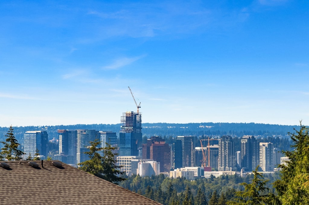 A view of the Bellevue skyline with a construction site in progress, highlighting the city's growth and the urban context of the ADHG developments